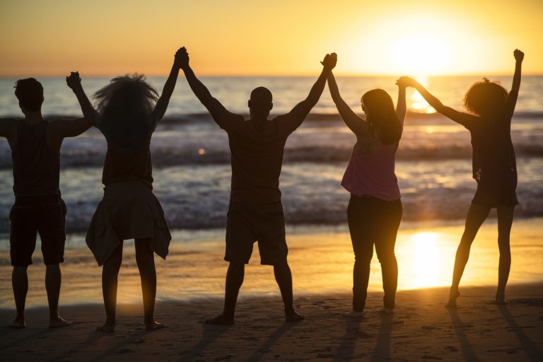 Group of young people looking at sunset