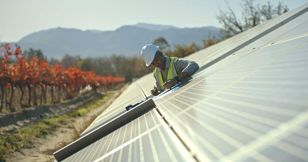 Close-up of solar panels in a rooftop clean energy project that lowers energy costs and strengthens community resilience